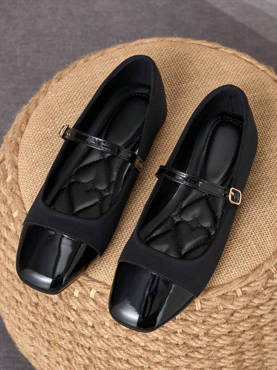Pair of women's square toe slip-on flat shoes featuring a delicate bow detail and low vamp design.