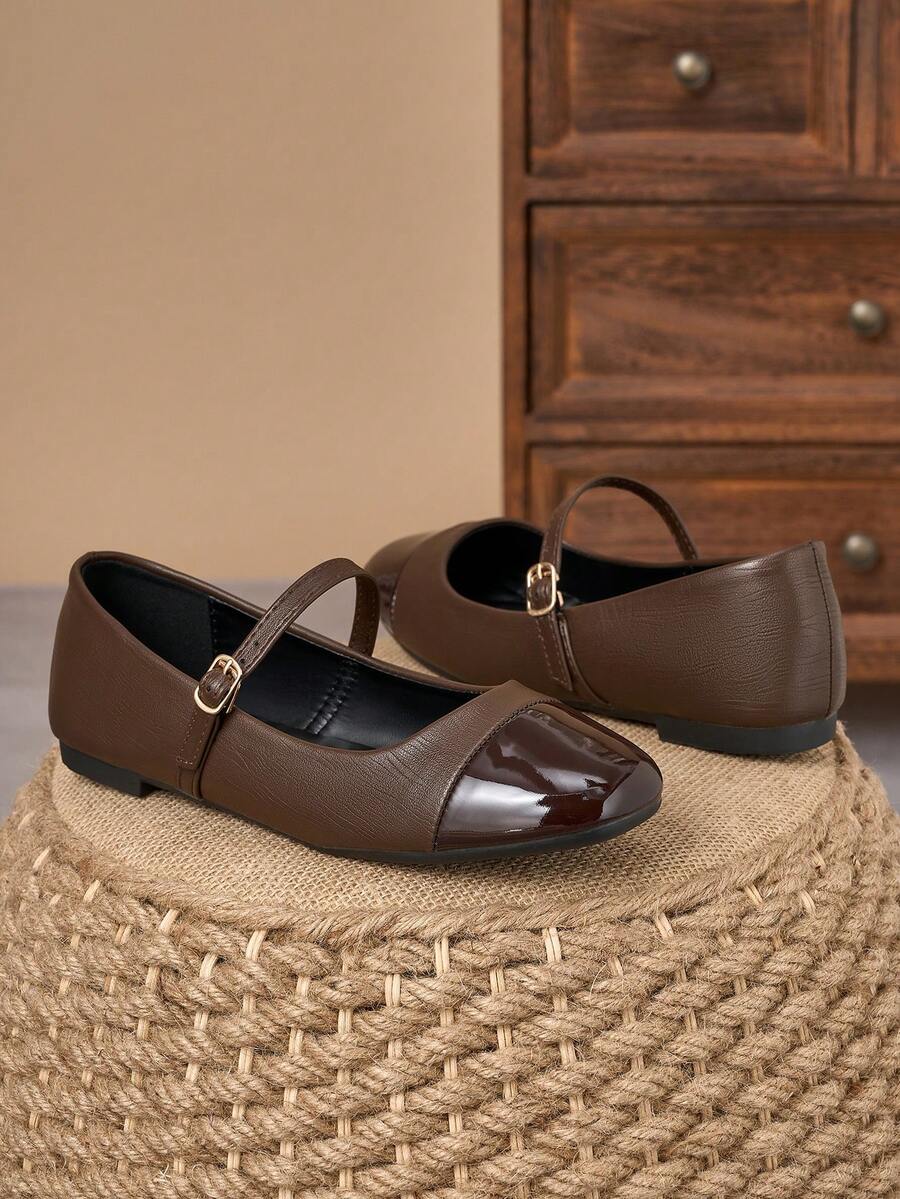 Pair of women's square toe slip-on flat shoes featuring a delicate bow detail and low vamp design.
