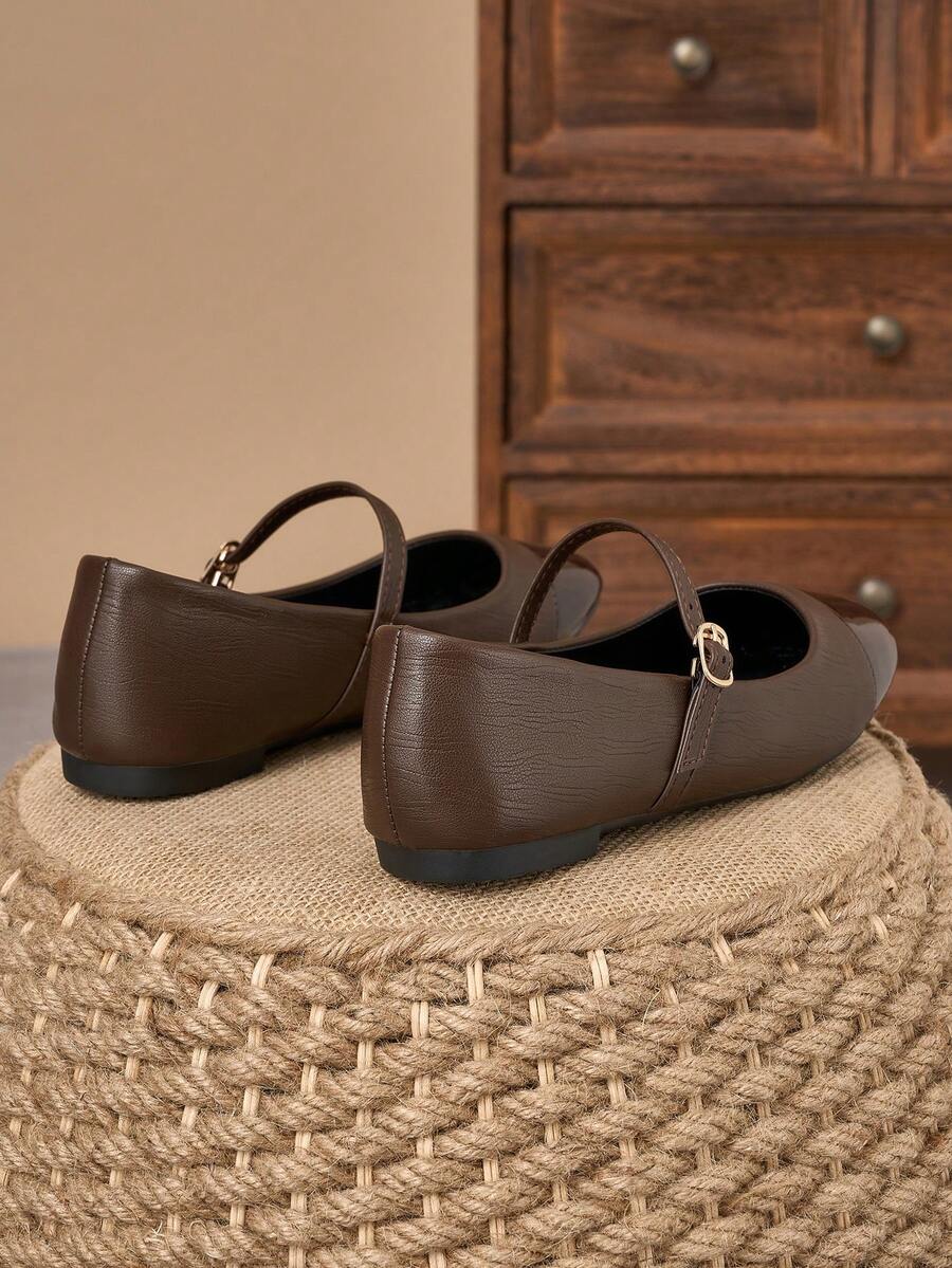 Pair of women's square toe slip-on flat shoes featuring a delicate bow detail and low vamp design.