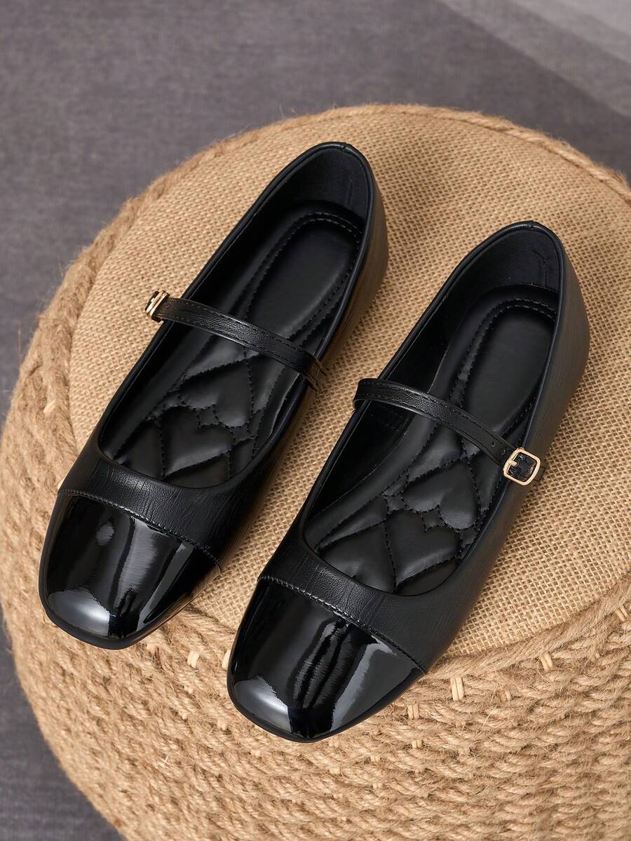 Pair of women's square toe slip-on flat shoes featuring a delicate bow detail and low vamp design.