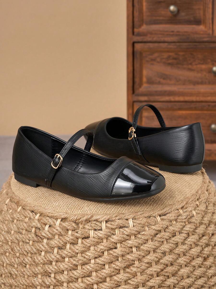 Pair of women's square toe slip-on flat shoes featuring a delicate bow detail and low vamp design.