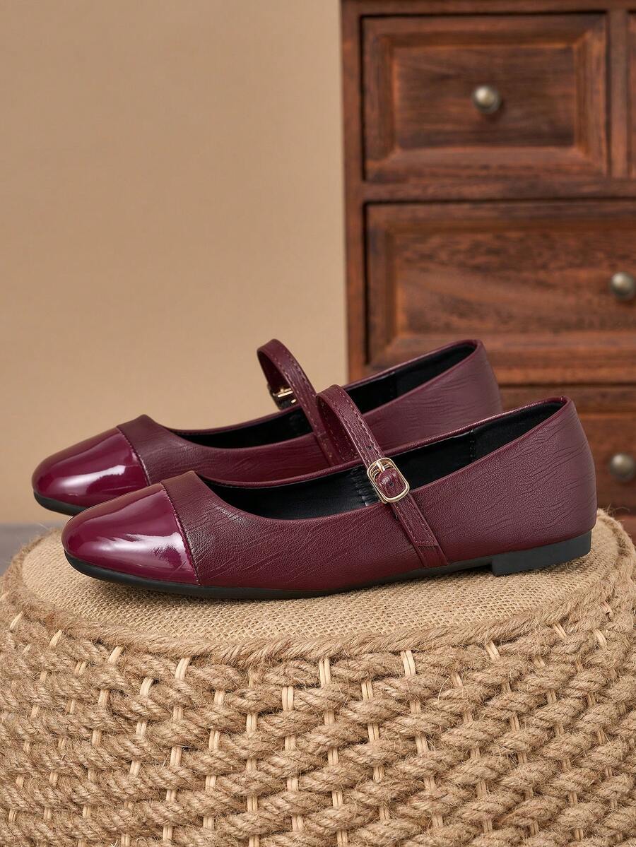 Pair of women's square toe slip-on flat shoes featuring a delicate bow detail and low vamp design.