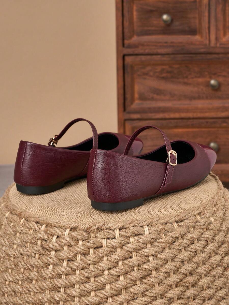 Pair of women's square toe slip-on flat shoes featuring a delicate bow detail and low vamp design.
