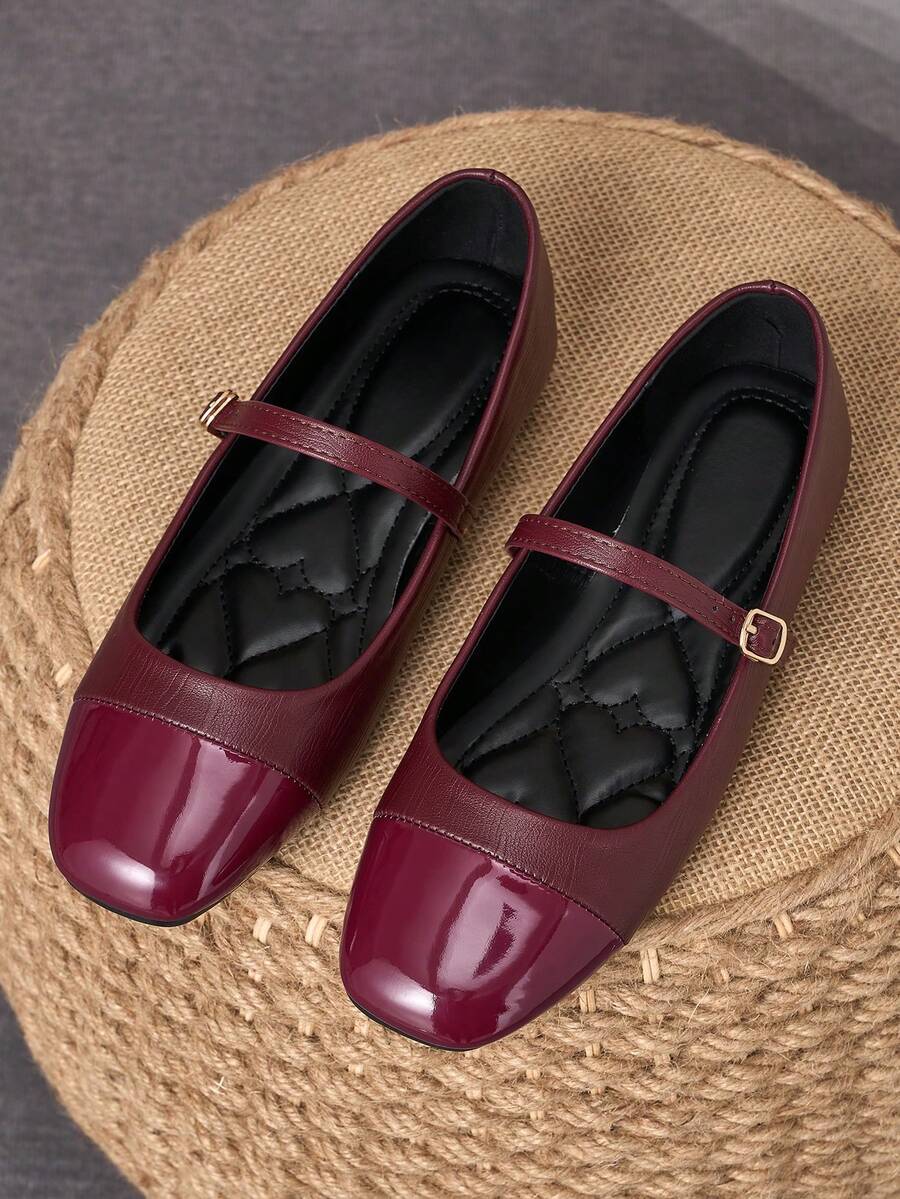 Pair of women's square toe slip-on flat shoes featuring a delicate bow detail and low vamp design.