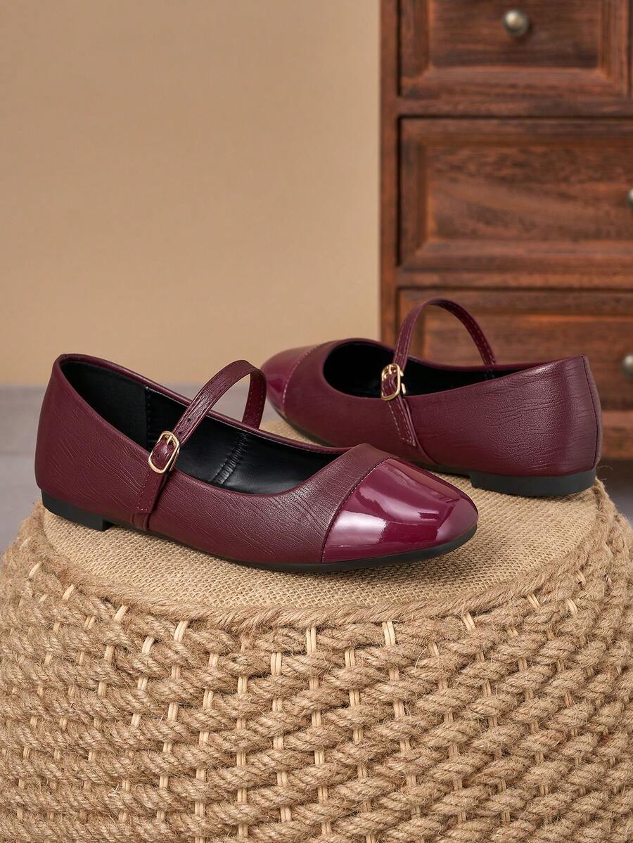 Pair of women's square toe slip-on flat shoes featuring a delicate bow detail and low vamp design.