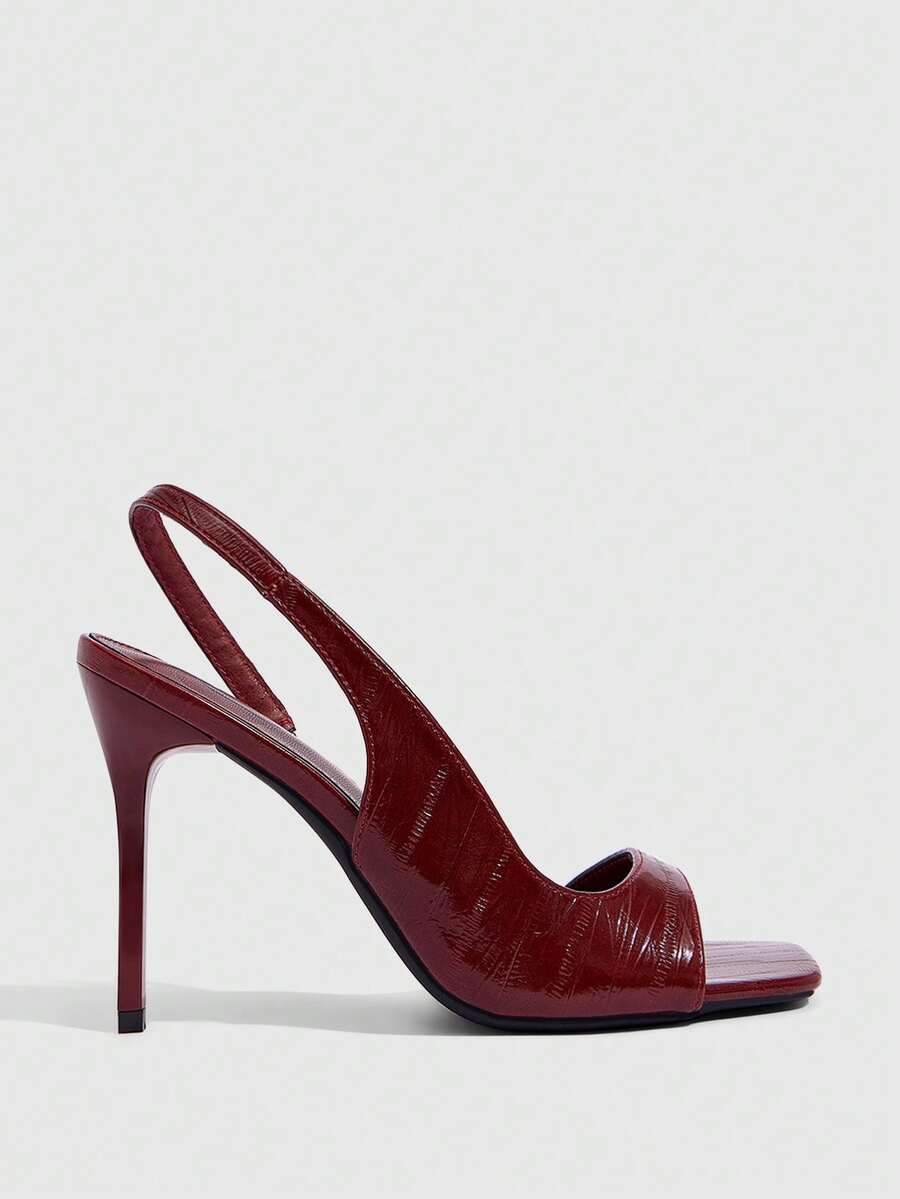 Women's burgundy open toe high heel sandals featuring an embossed finish and slingback strap