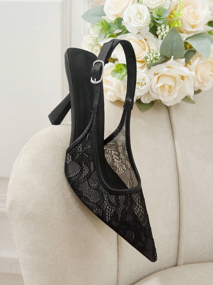 Pointed toe stiletto high heel pumps featuring black lace mesh upper, buckle slingback detail, and sleek slip-on design for weddings and evening wear.