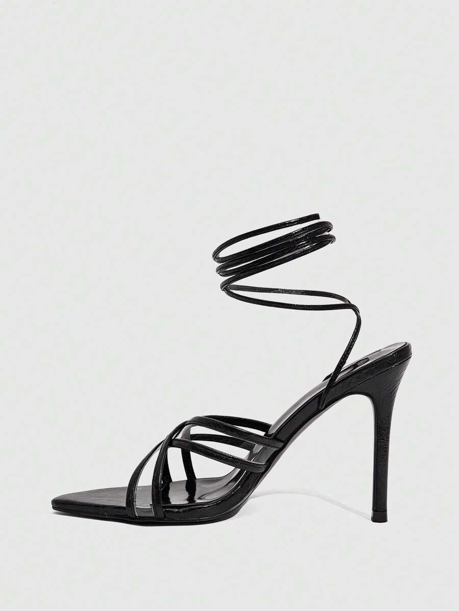 Women's high heel pointed strappy sandals with criss cross lace-up detail and stiletto heel