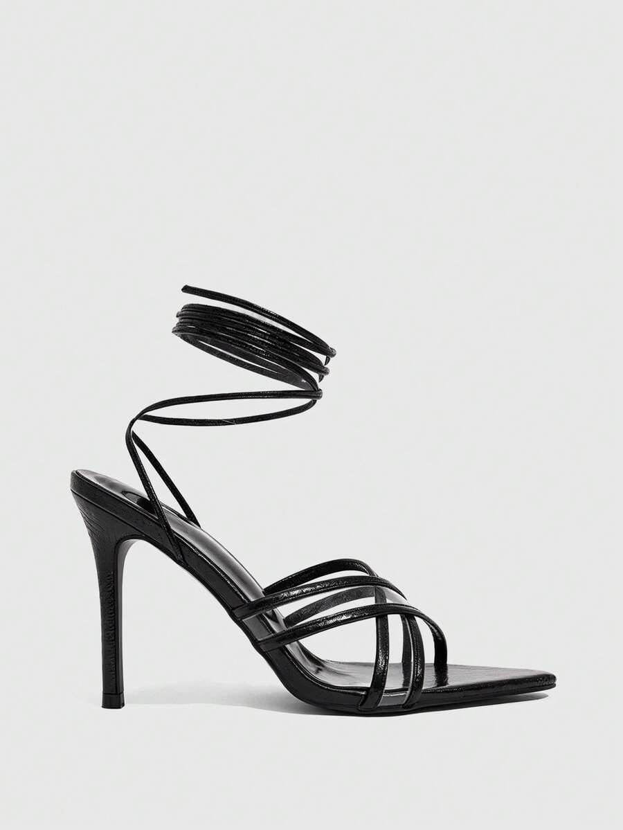 Women's high heel pointed strappy sandals with criss cross lace-up detail and stiletto heel