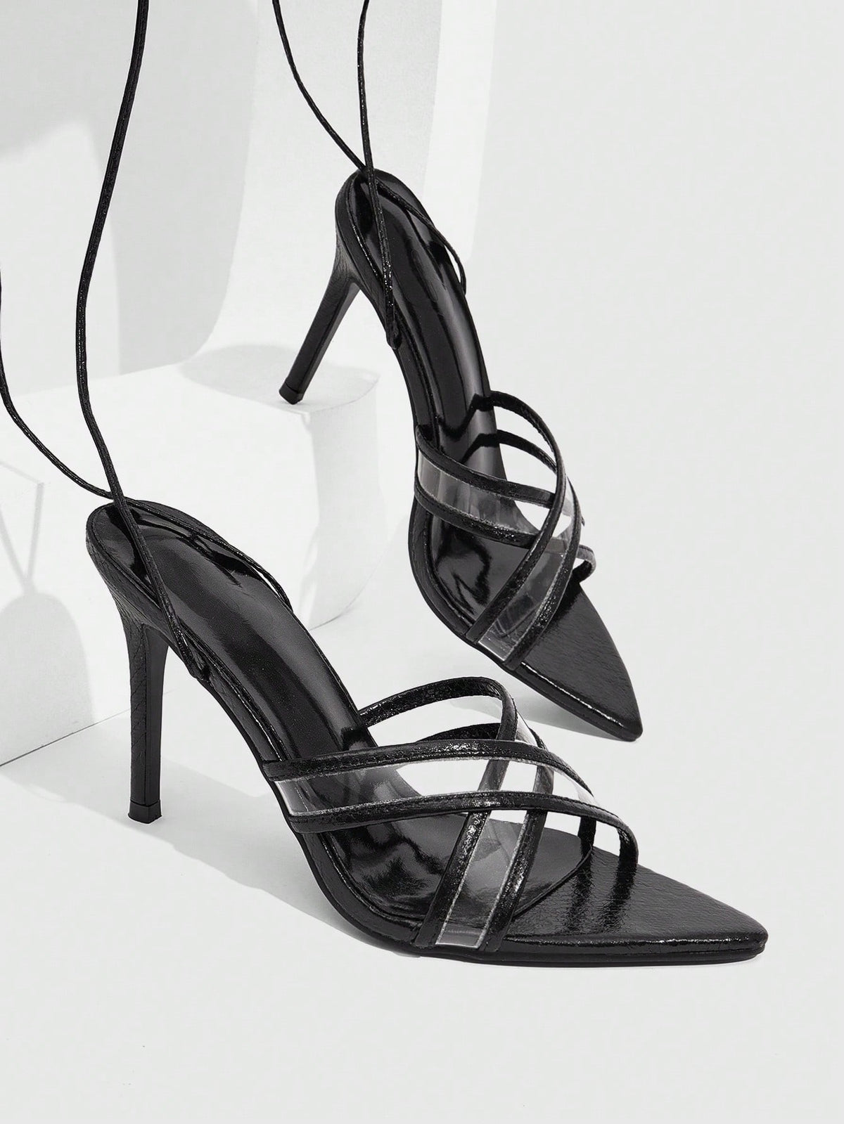 Women's high heel pointed strappy sandals with criss cross lace-up detail and stiletto heel