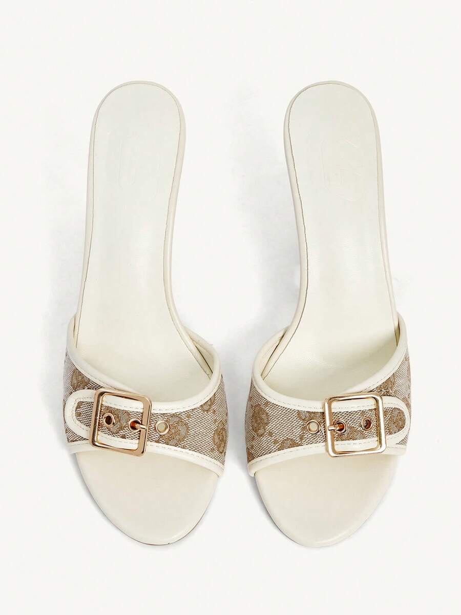 Women's black open round toe high heel slippers featuring mesh stitching, grommet buckle strap, and stiletto heel.