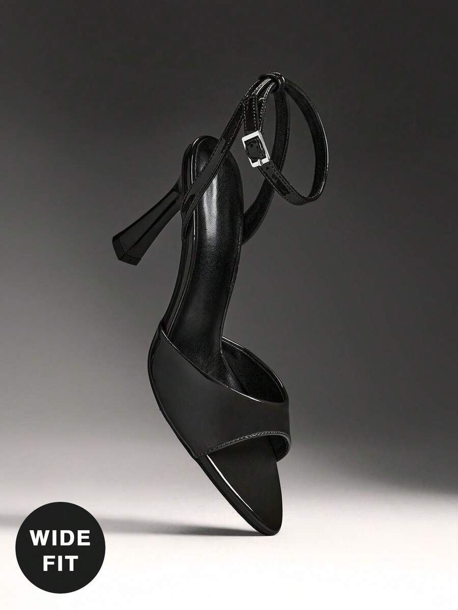 Women's wide-fit stiletto heel sandals featuring an open-toe design, slender mid stiletto heel, and adjustable ankle strap.