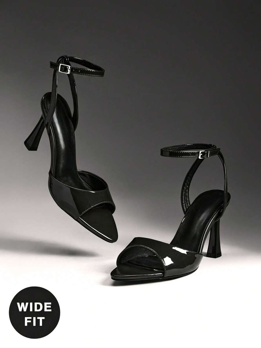 Women's wide-fit stiletto heel sandals featuring an open-toe design, slender mid stiletto heel, and adjustable ankle strap.
