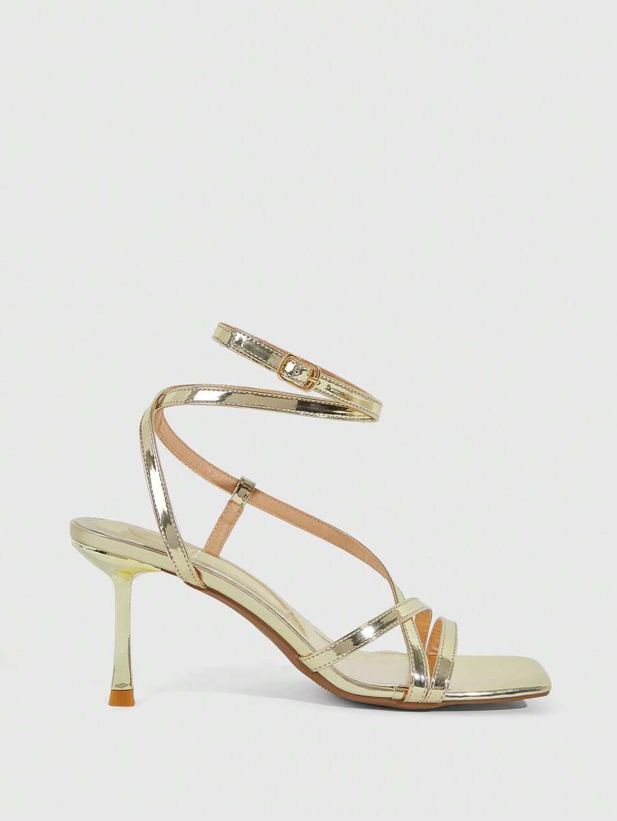 Women's open toe stiletto heel sandals featuring square toe design, criss-cross rhinestone slim straps, and secure ankle strap.