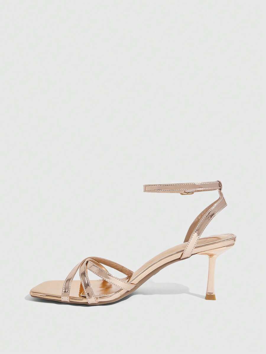 Women's open toe stiletto heel sandals featuring square toe design, criss-cross rhinestone slim straps, and secure ankle strap.