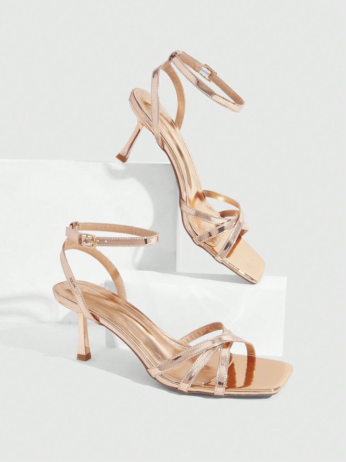 Women's open toe stiletto heel sandals featuring square toe design, criss-cross rhinestone slim straps, and secure ankle strap.