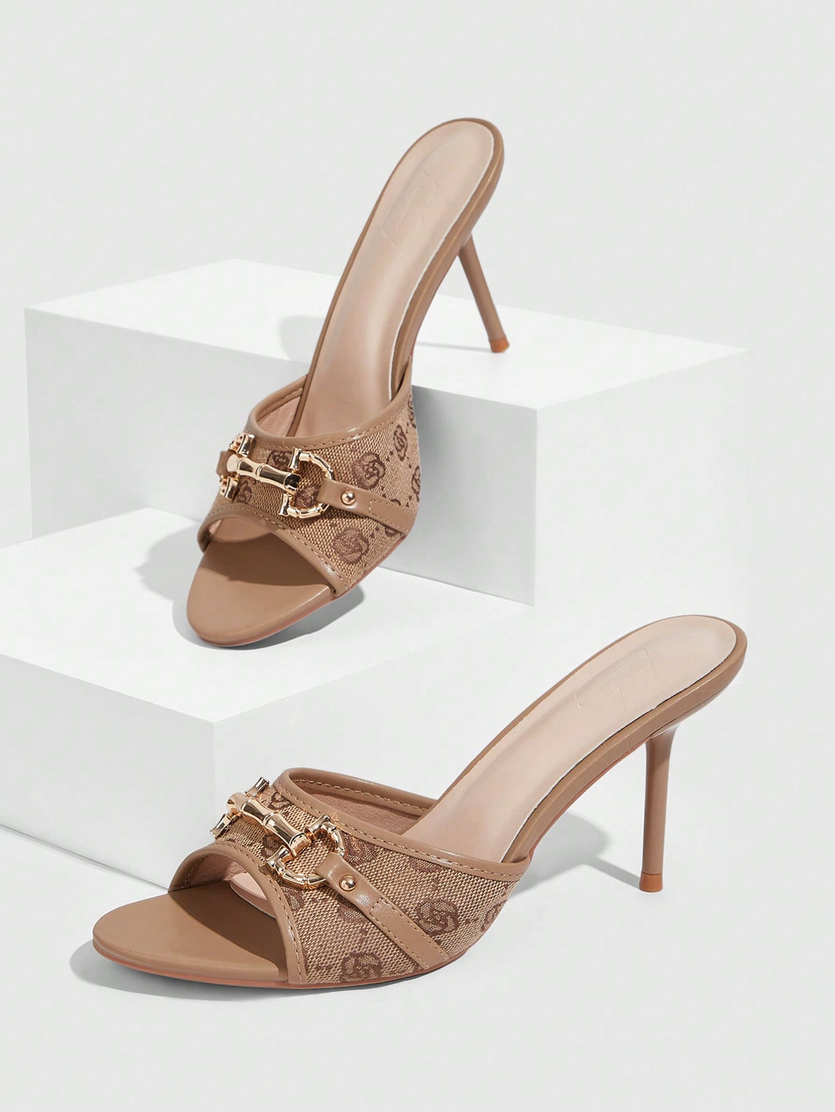 Beige pointed toe mule high heel sandals featuring gold buckle accent