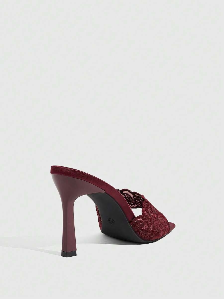 Women's square toe stiletto high heel slide sandals featuring contrast mesh embroidery and an open-toe backless design.