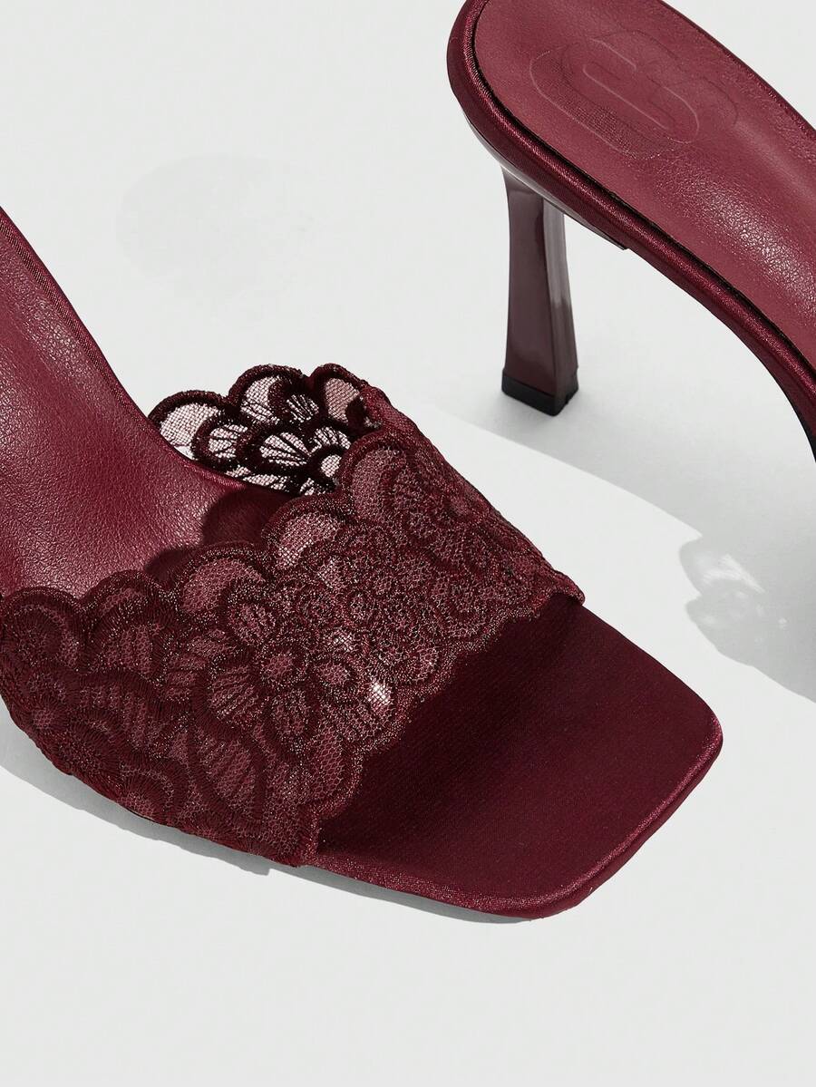 Women's square toe stiletto high heel slide sandals featuring contrast mesh embroidery and an open-toe backless design.
