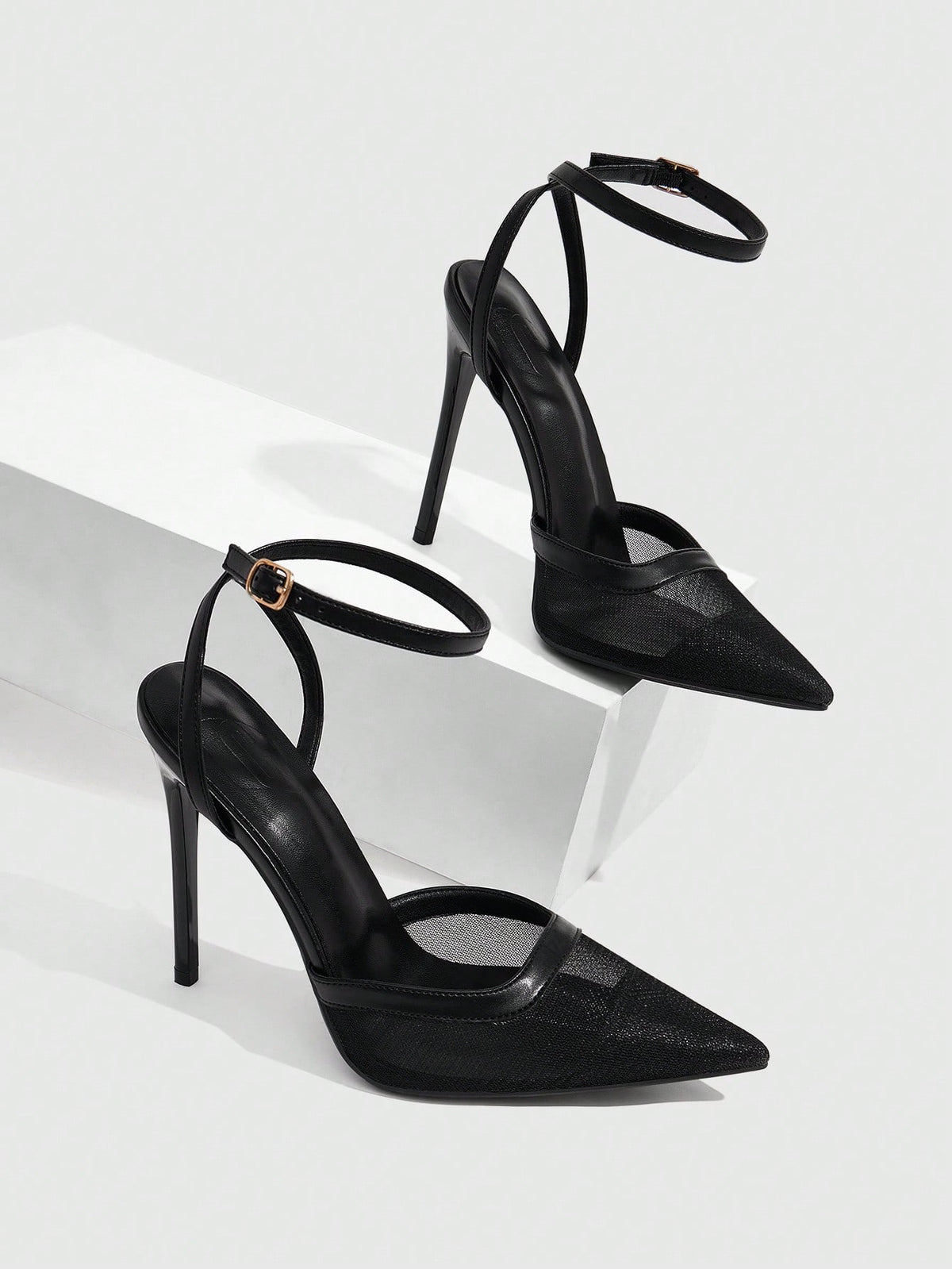Women's pointed toe high heel shoes featuring breathable mesh detailing, stiletto heel, and adjustable ankle strap with buckle closure.