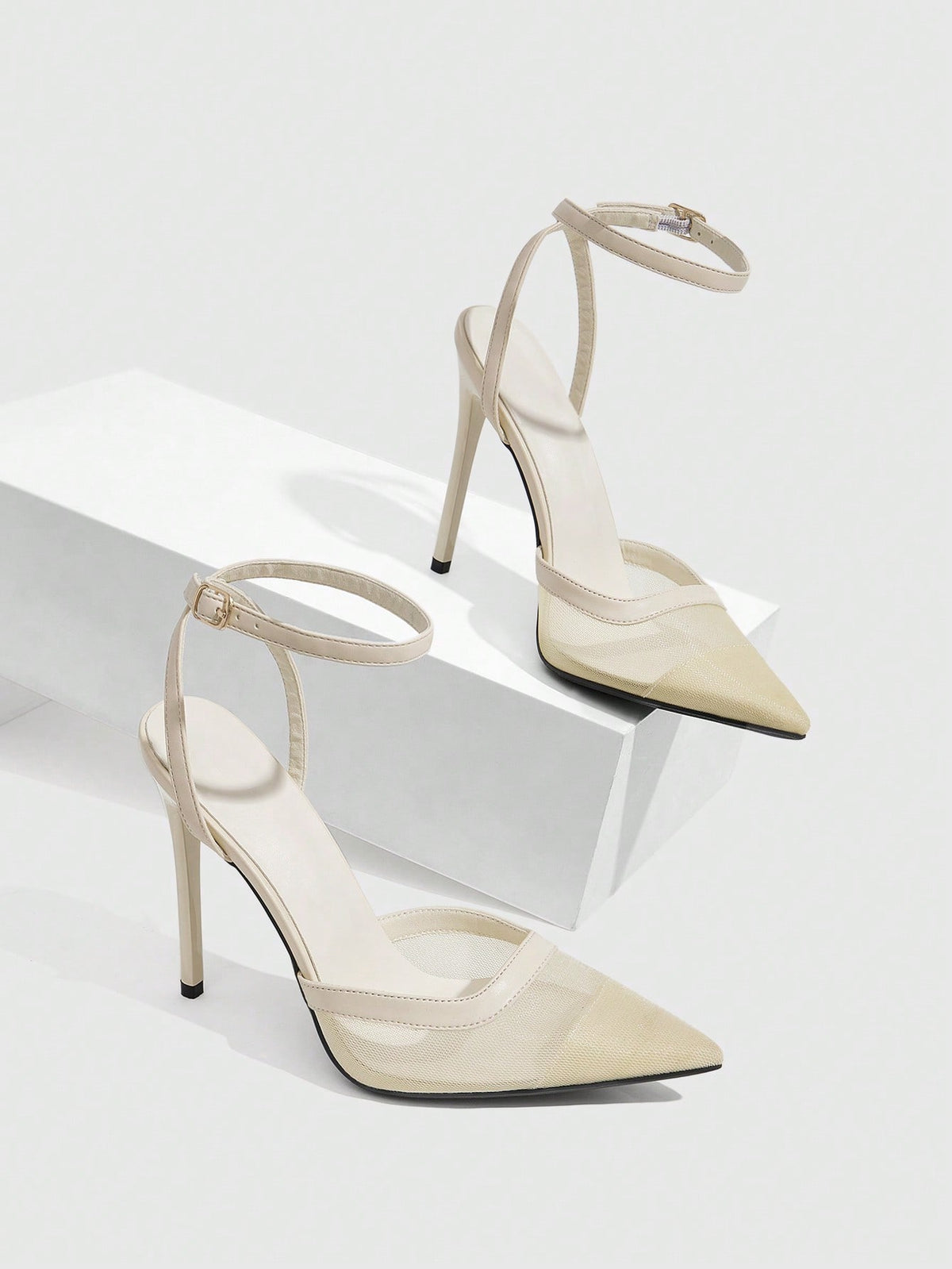 Women's pointed toe high heel shoes featuring breathable mesh detailing, stiletto heel, and adjustable ankle strap with buckle closure.