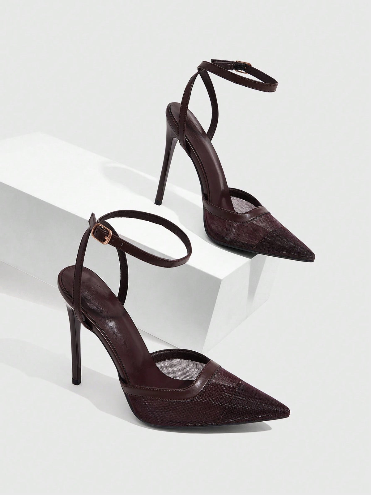 Women's pointed toe high heel shoes featuring breathable mesh detailing, stiletto heel, and adjustable ankle strap with buckle closure.