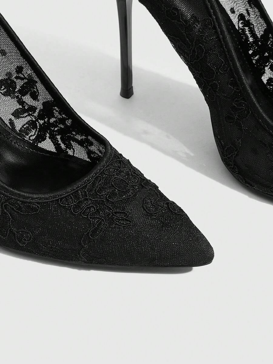 Women's pointed clear lace heels with contrast mesh, floral embroidery, and stiletto high heel with buckle strap.