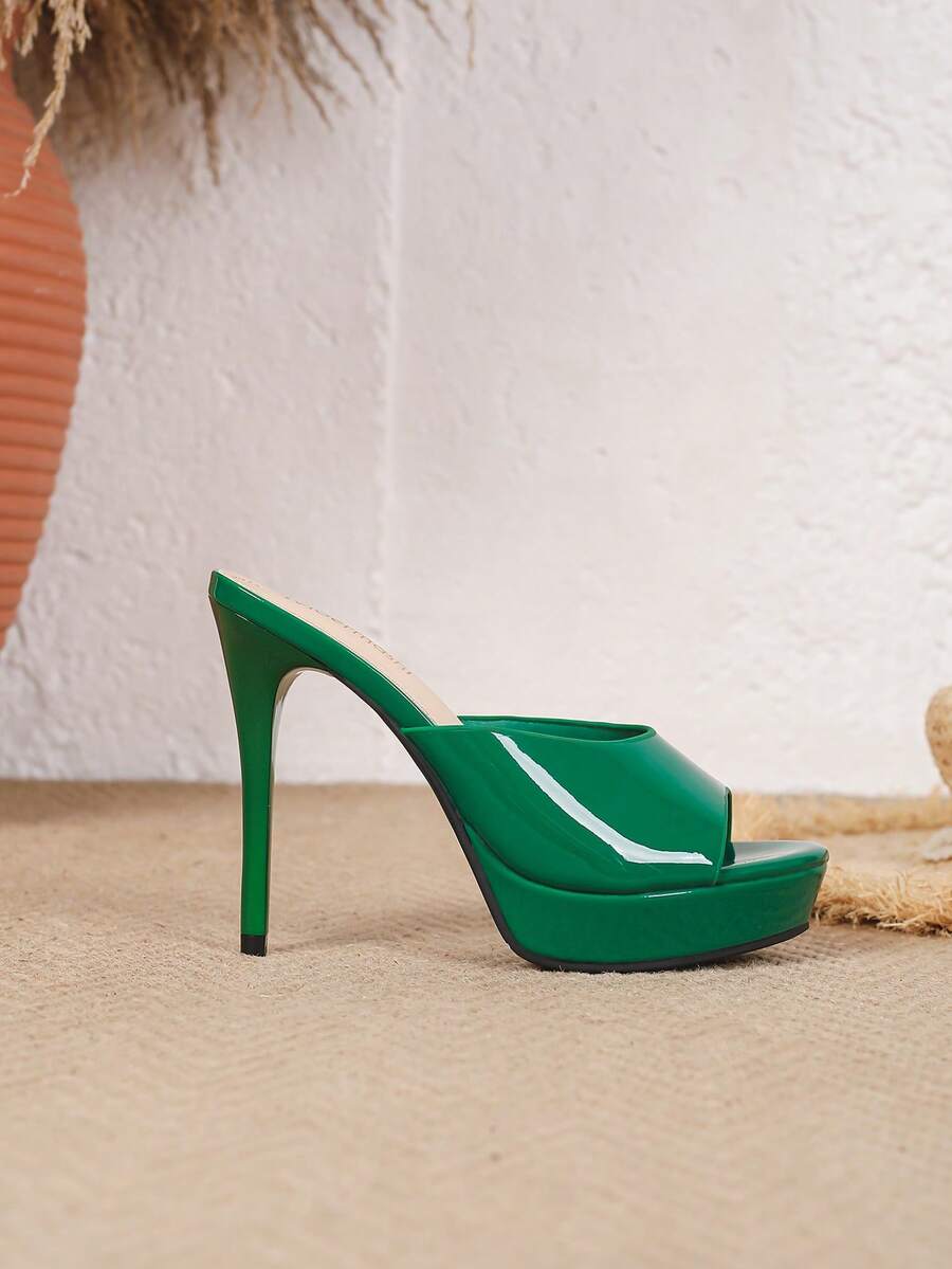 Women's patent leather stiletto heel sandals with open toe ruched slip on mule design.