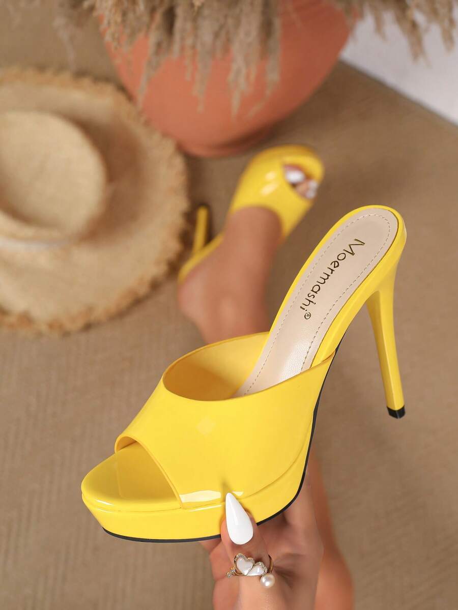 Women's patent leather stiletto heel sandals with open toe ruched slip on mule design.