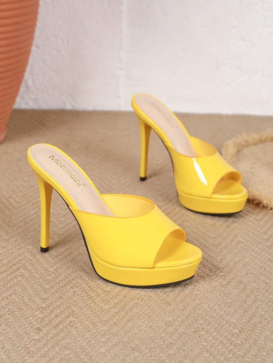 Women's patent leather stiletto heel sandals with open toe ruched slip on mule design.
