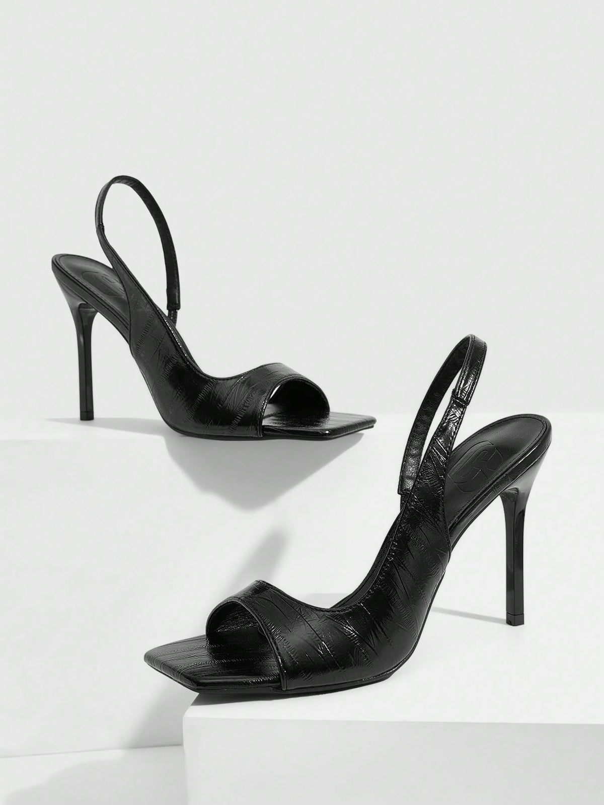 Women's burgundy open toe high heel sandals featuring an embossed finish and slingback strap