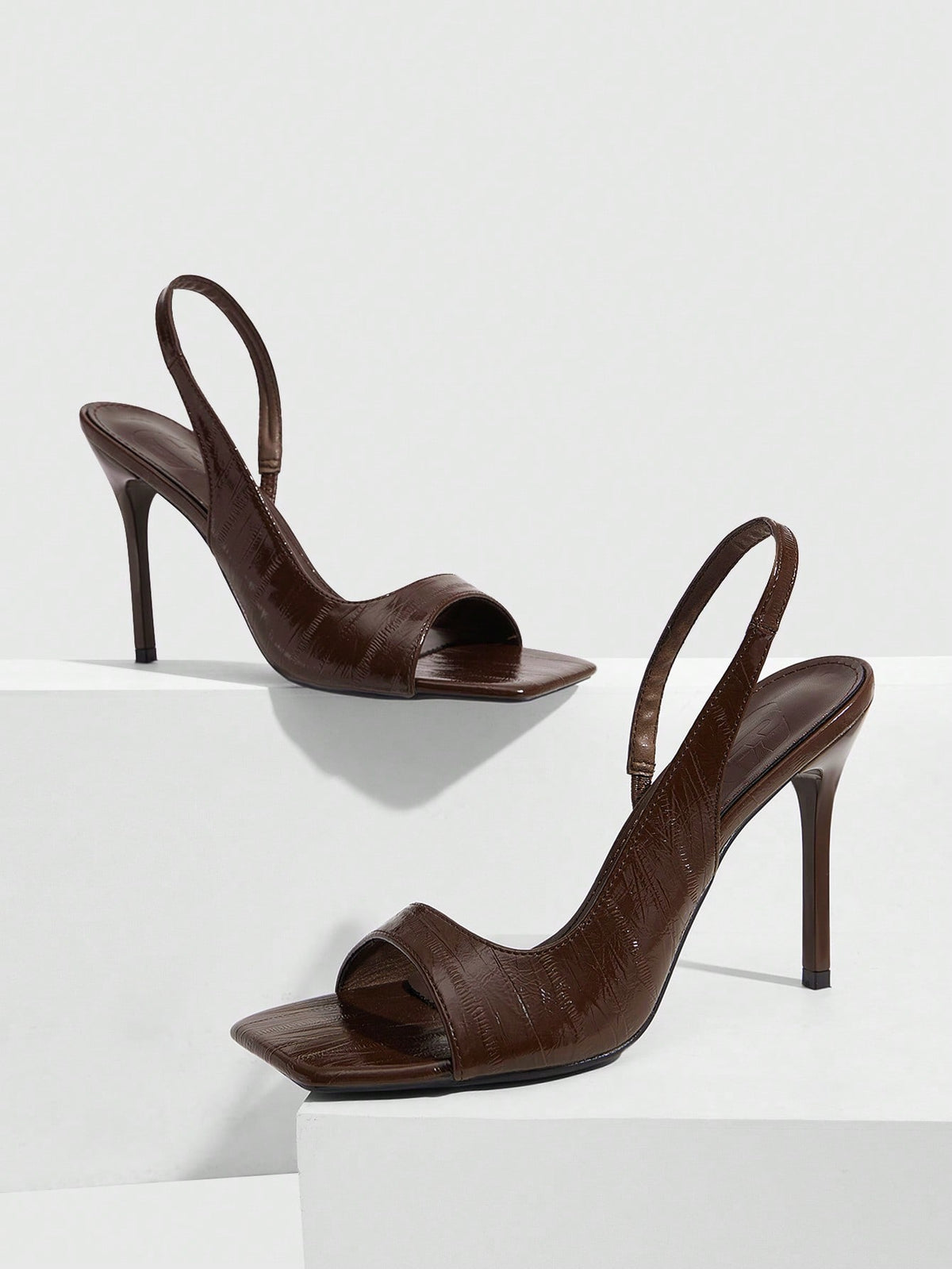 Women's burgundy open toe high heel sandals featuring an embossed finish and slingback strap