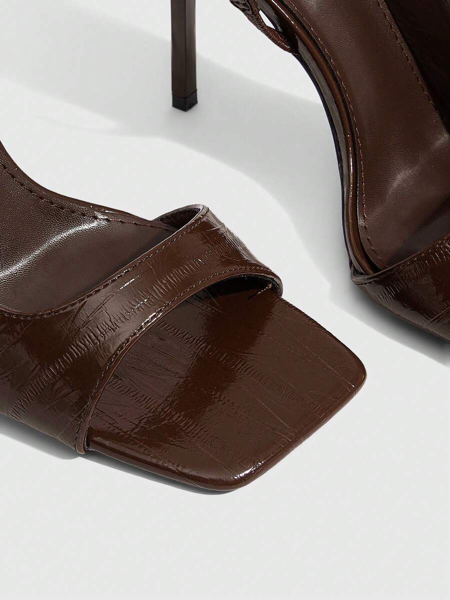 Women's burgundy open toe high heel sandals featuring an embossed finish and slingback strap