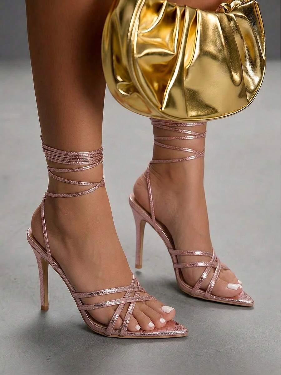 Women's high heel pointed strappy sandals with criss cross lace-up detail and stiletto heel