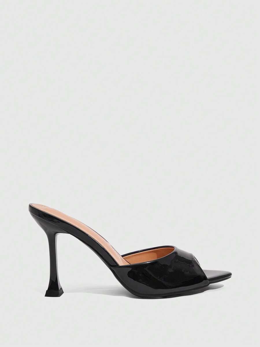 Women's sleek high heel slingback sandals with PU leather finish and stylish pyramid heel.