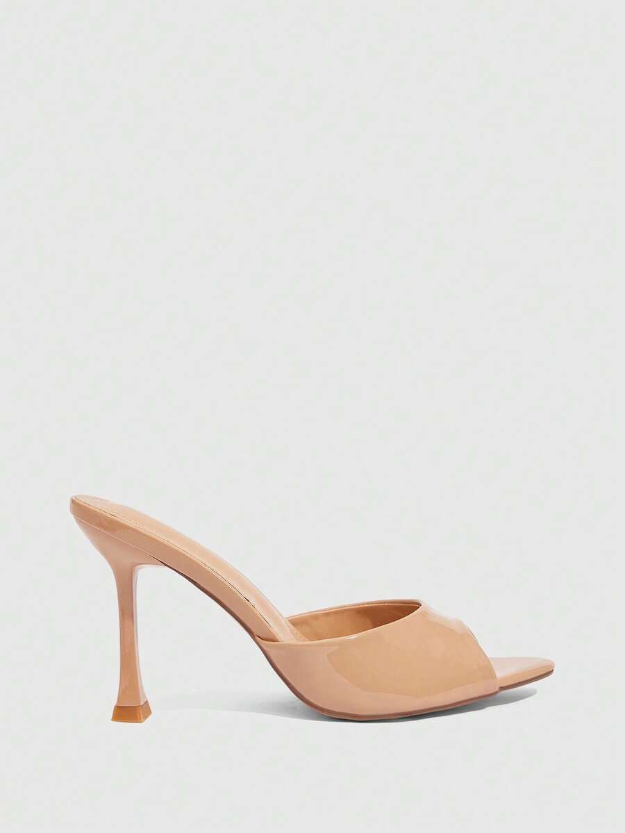 Women's sleek high heel slingback sandals with PU leather finish and stylish pyramid heel.
