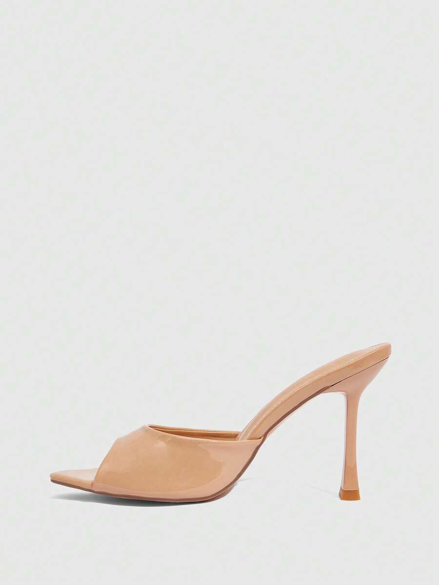 Women's sleek high heel slingback sandals with PU leather finish and stylish pyramid heel.