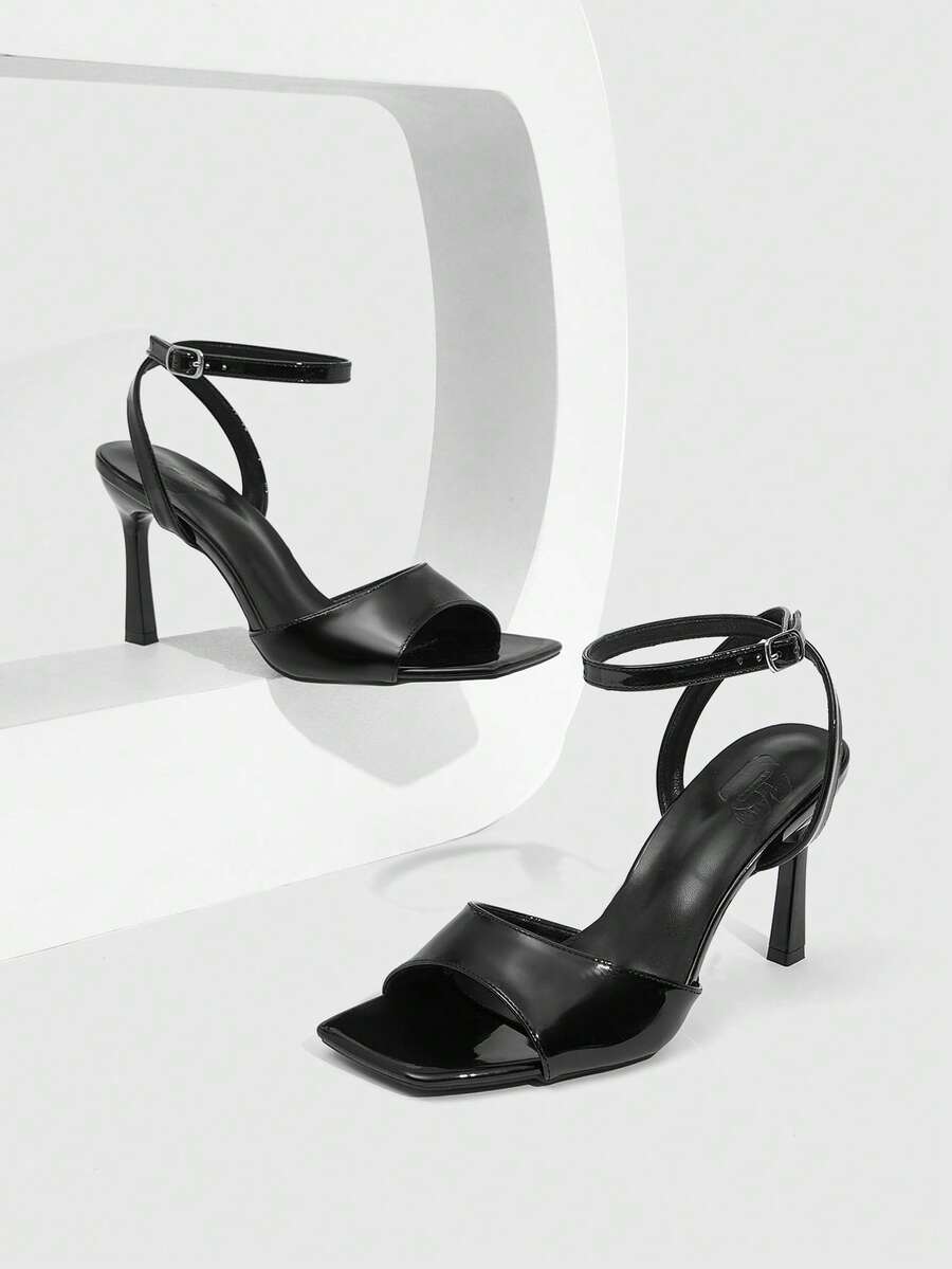 Women's peep toe ankle strap high heel sandals featuring a sleek stiletto heel and adjustable buckle closure.