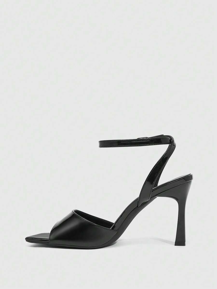 Women's peep toe ankle strap high heel sandals featuring a sleek stiletto heel and adjustable buckle closure.