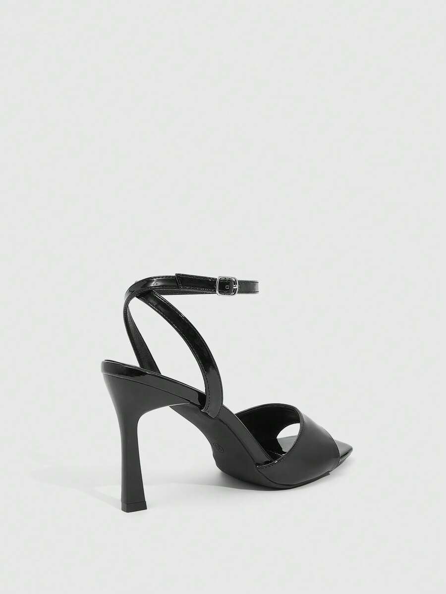 Women's peep toe ankle strap high heel sandals featuring a sleek stiletto heel and adjustable buckle closure.