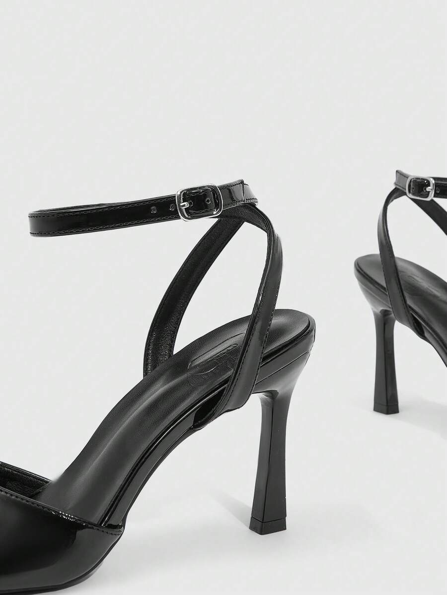 Women's peep toe ankle strap high heel sandals featuring a sleek stiletto heel and adjustable buckle closure.