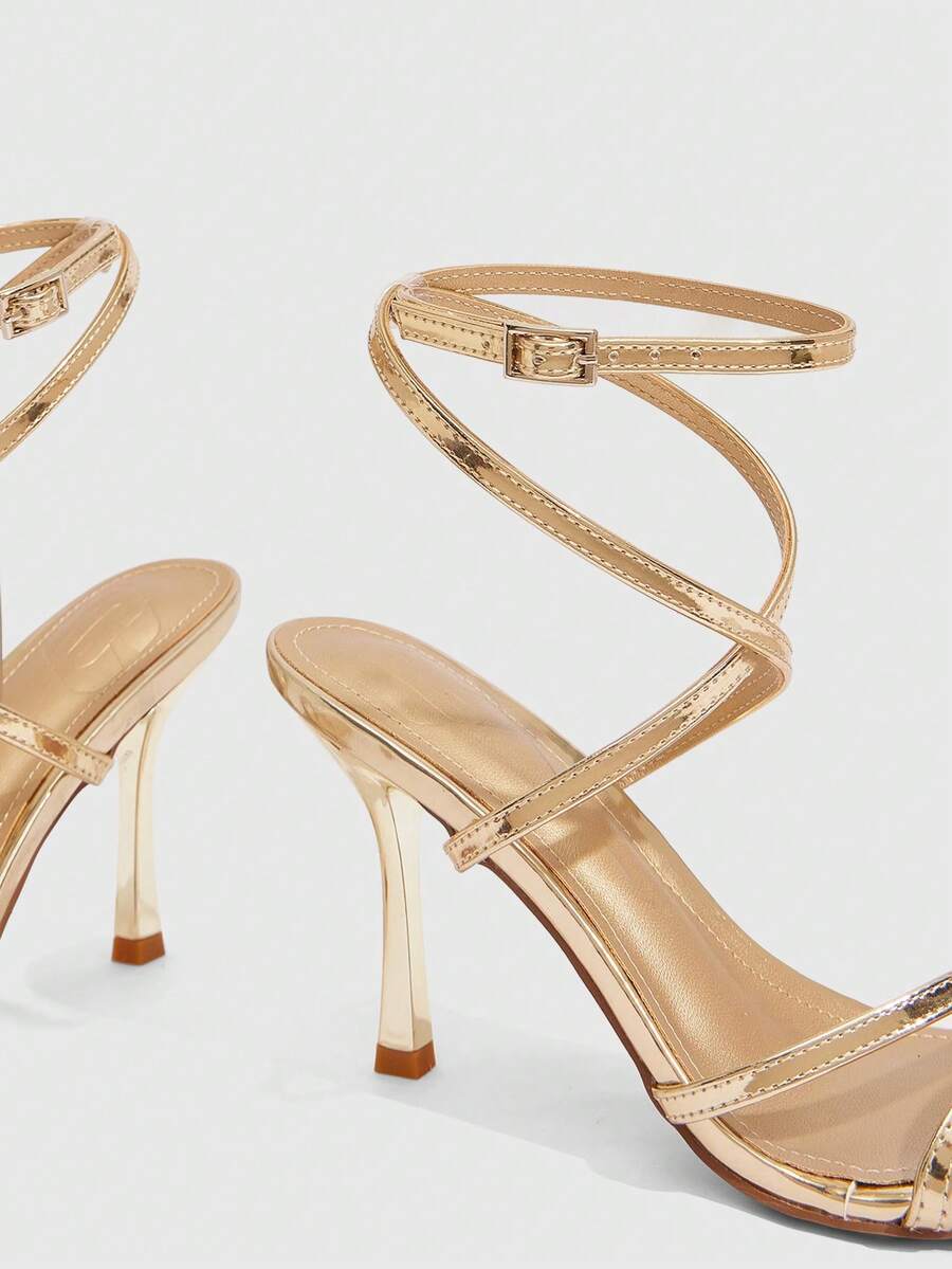Women's square toe stiletto high heeled sandals with ankle strap buckle in a sleek faux leather finish.