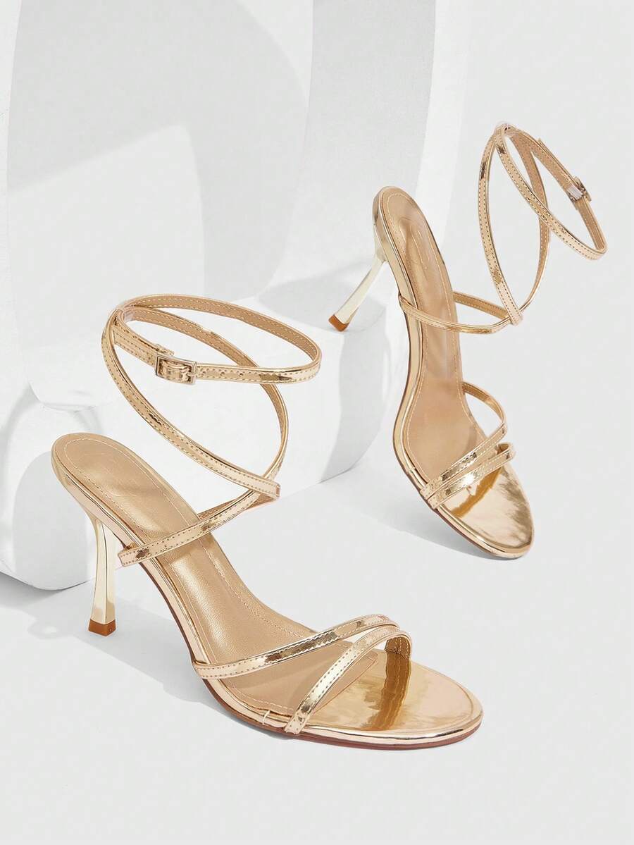 Women's square toe stiletto high heeled sandals with ankle strap buckle in a sleek faux leather finish.