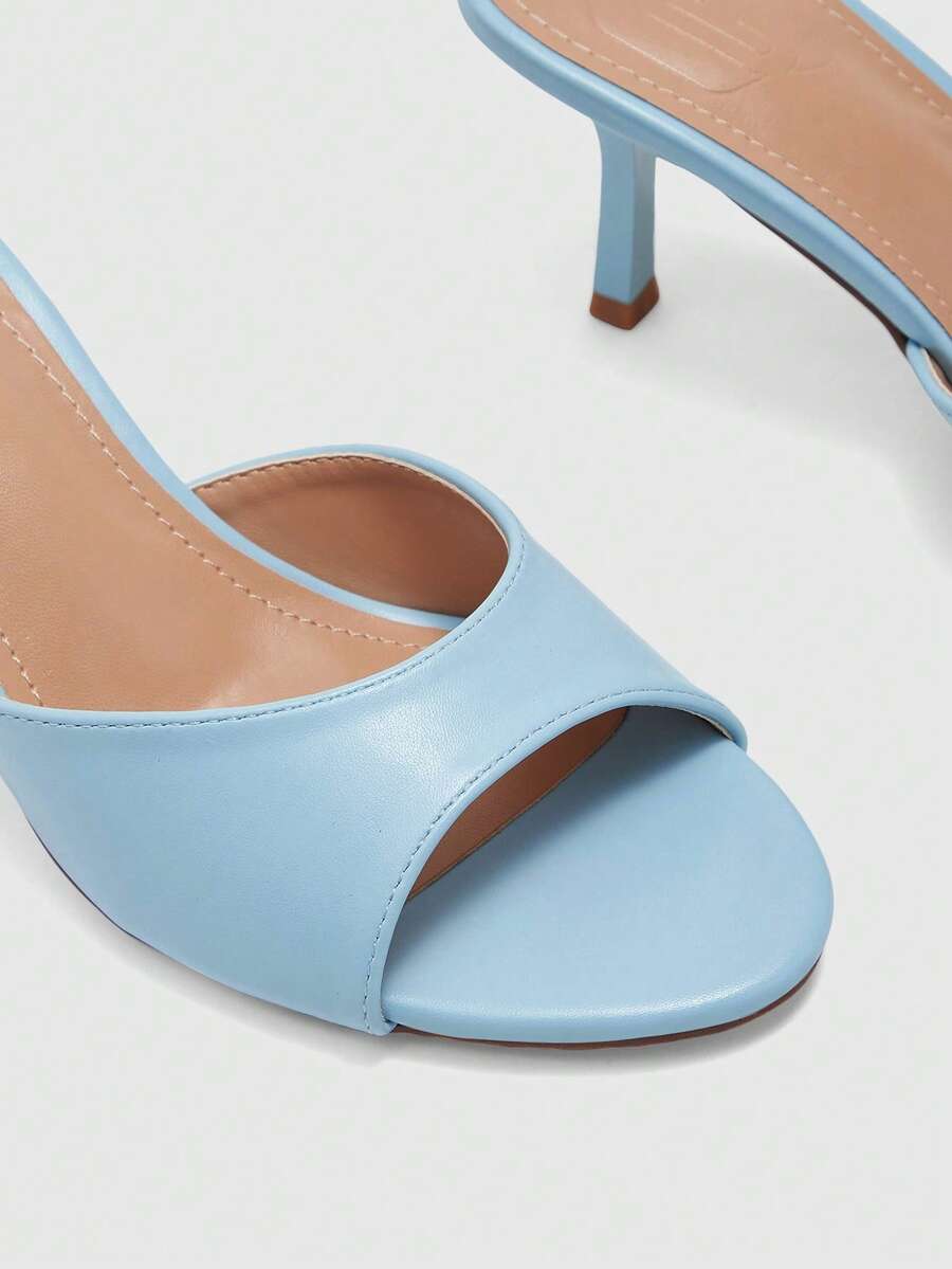 Pair of women's open toe high heel slingback sandals made with smooth PU leather