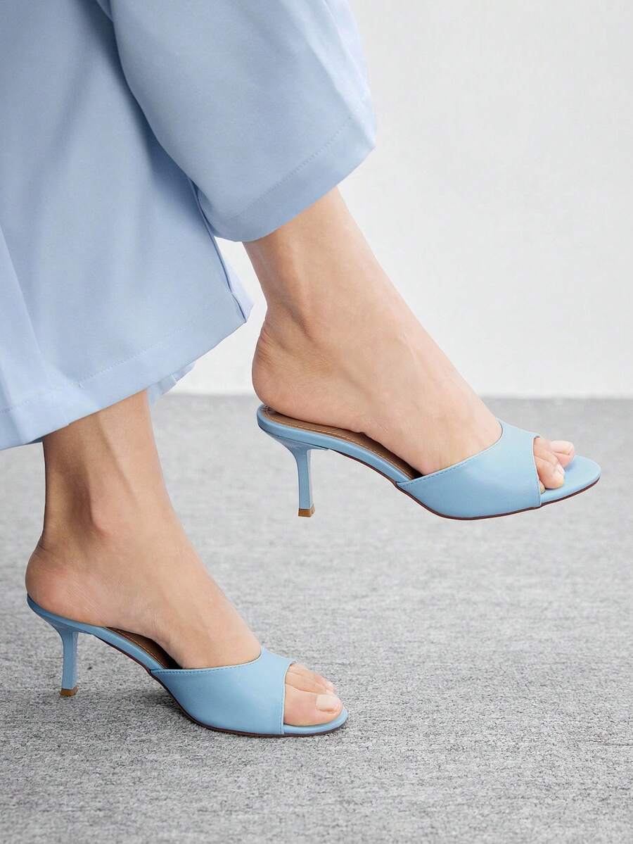 Pair of women's open toe high heel slingback sandals made with smooth PU leather