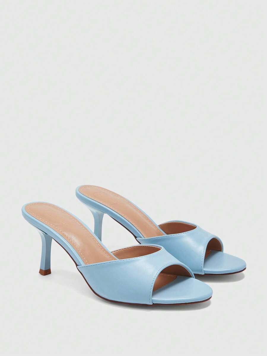 Pair of women's open toe high heel slingback sandals made with smooth PU leather