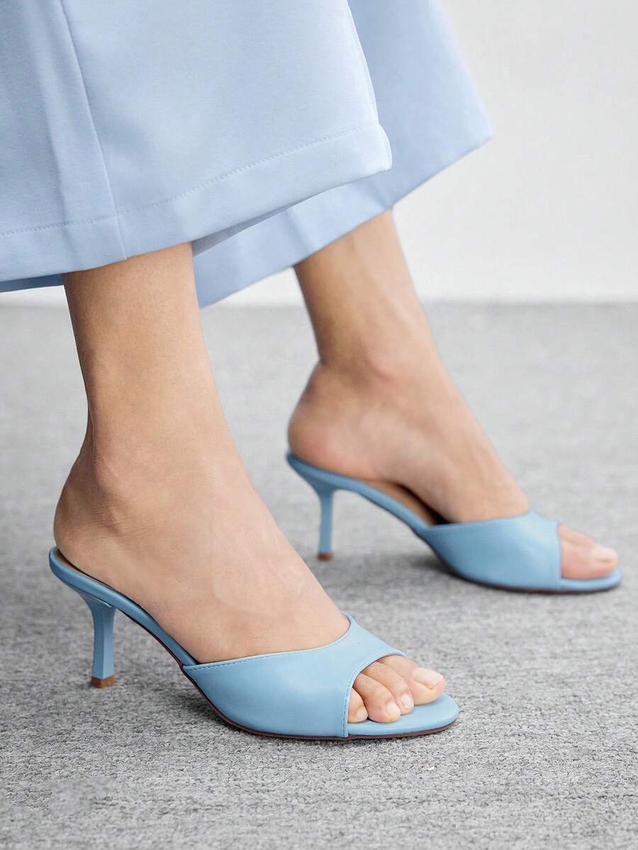 Pair of women's open toe high heel slingback sandals made with smooth PU leather