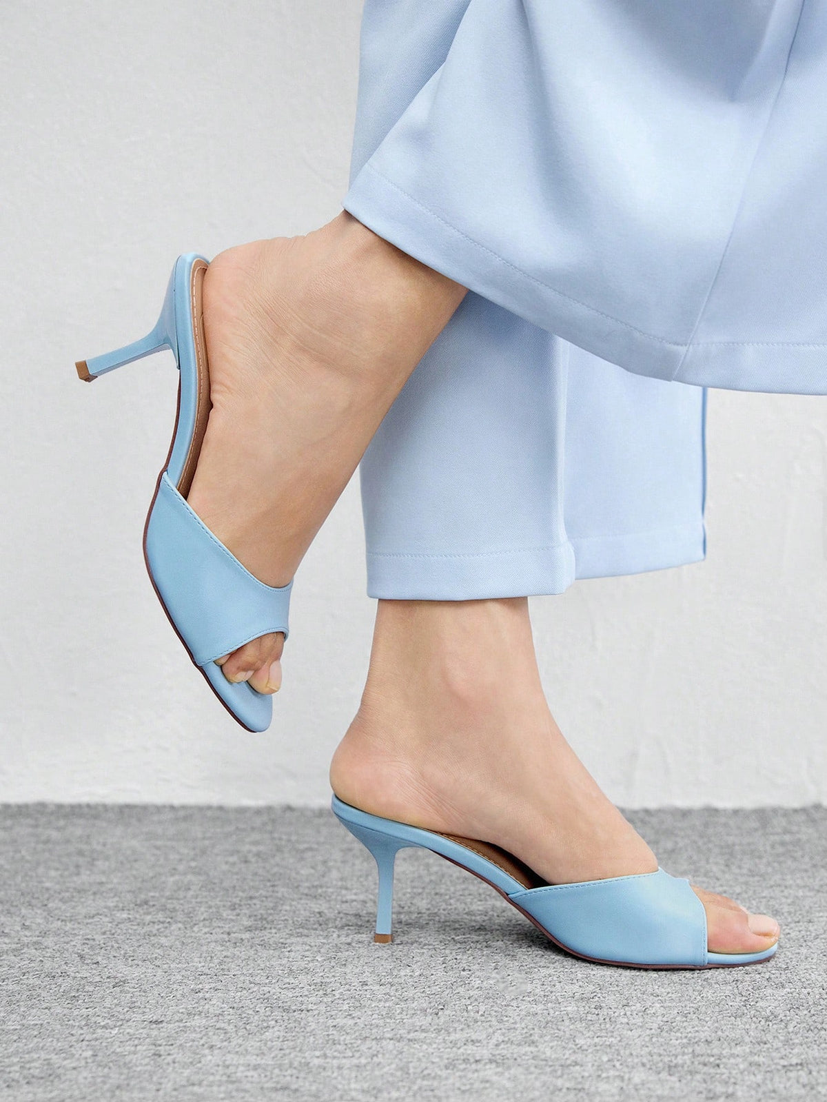 Pair of women's open toe high heel slingback sandals made with smooth PU leather