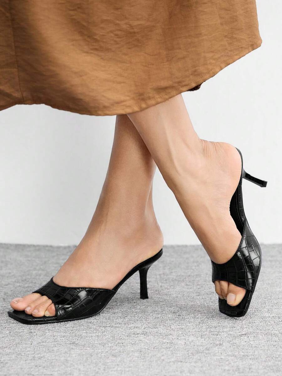 Women's black square toe high heel sandals featuring an open toe design, thin stiletto heel, and slingback strap.