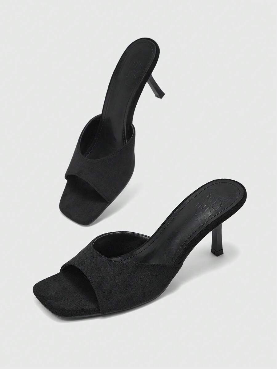 Women's black square toe high heel sandals featuring an open toe design, thin stiletto heel, and slingback strap.